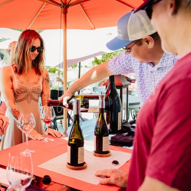 Sampling wine at bar